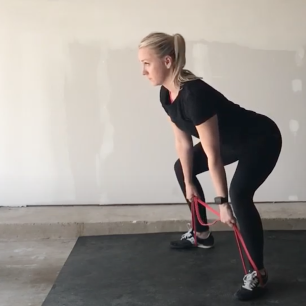 how to do band deadlift, demonstrated by Kathryn Alexander of Alexander Training