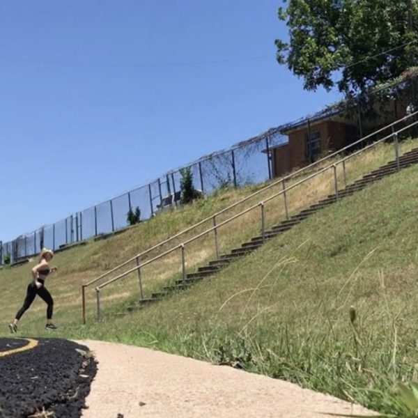 Kathryn Alexander doing HIIT (high intensity interval) training on stairs in Austin, Texas.