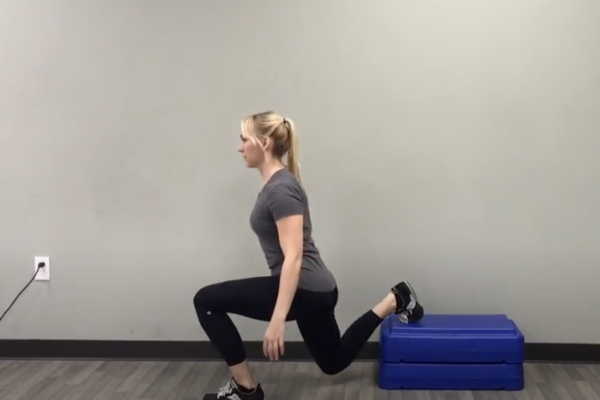 Bulgarian split squat or rear leg elevated split squat demonstrated by Kathryn Alexander of Alexander Training