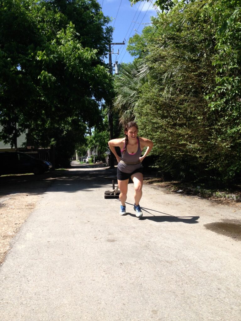 Abby pulls the sled while training with Kathryn at Alexander Training.