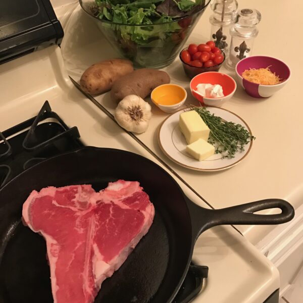 Steak on the stovetop; cowboy steak in cast iron