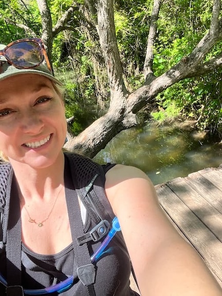 trainer Kathryn Alexander hiking near Austin